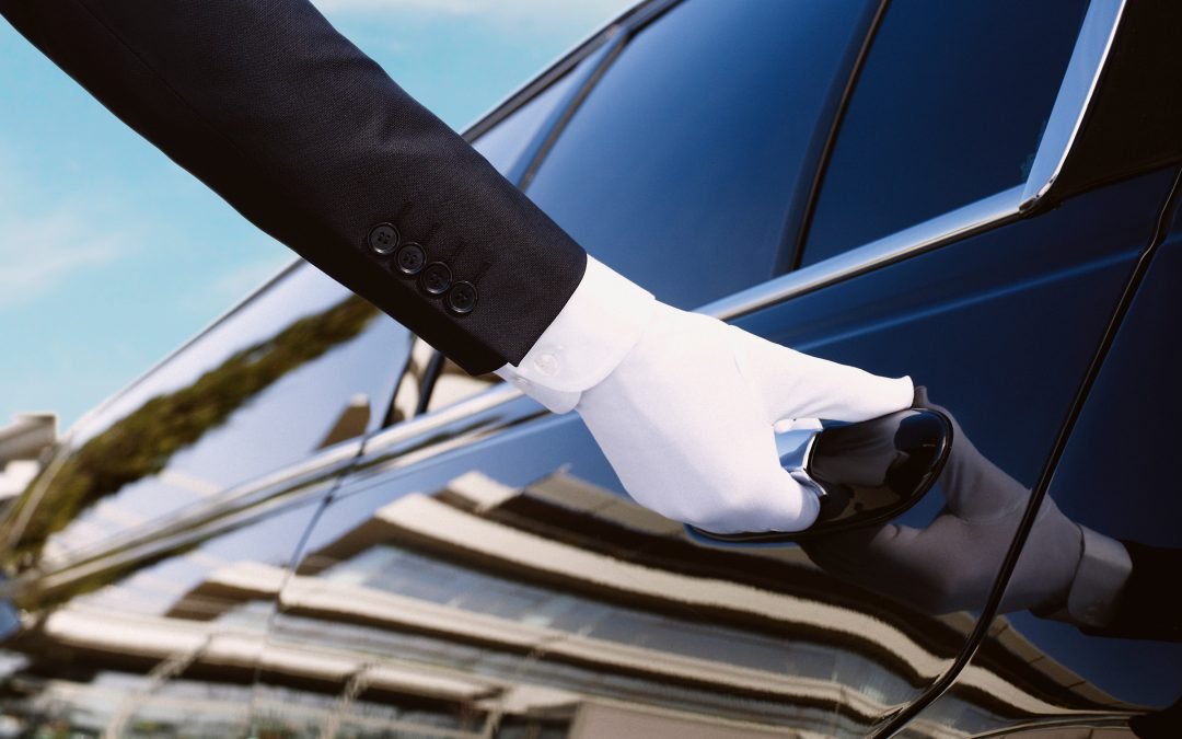 Concierge Hand in white glove opening car door
