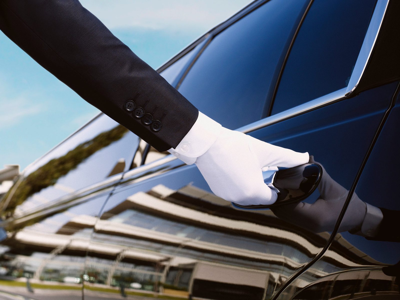 Concierge Hand in white glove opening car door